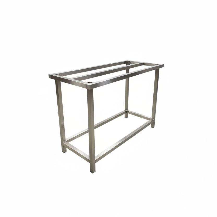 Metal workbench in a workshop setting with tools and equipment in the background..